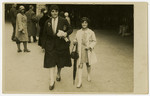 Hannie Reinsch and her daughter Helga walk down a street.