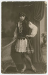 Studio portrait of Baila Lubochinski, the sister of Malka Lubochinski, dressed in a folk costume.