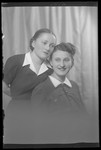 Studio portrait of two young women, one of whom is Iren Friedman.