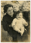 Dora Tennenbaum holds her baby Edith on her lap.