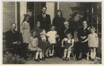 Group photograph of two Dutch rescuers families and the two Jewish sisters they saved.