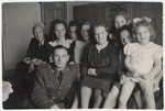 Postwar family of a Dutch Jewish family.

Pictured on the left is Sigmund Kleerkoper in his army uniform and his wife seated behind him.