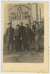 Jewish youth pose under a sign in the Palestine Transit Camp in Bocholt Germany prior to their departure for Palestine.
