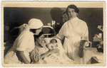 Two nurses in a Kaunas hospital attend to Gerta Bagriansky after she gave birth to her daughter Rosian.