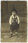 Close-up portrait of a young German-Jewish boy in Mannheim wearing lederhosen.