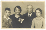 Studio portrait of a German-Jewish family prior to the emigration of the wife and children.