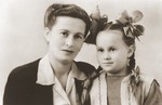 Studio portrait of a Jewish DP mother and daughter in the Trani displaced persons camp.