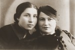 Studio portrait of two Jewish friends in Goloby, Poland.