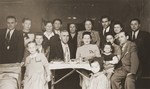 Group portrait of Jewish DPs at a going away party in the Trani displaced persons camp.