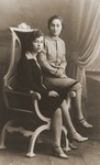 Studio portrait of two Jewish sisters in Goloby, Poland.