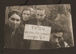 Members of the Tracz family pose at the grave of Izak Tracz, who died on January 23, 1944 in Gorky.