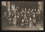 Dutch children pose in traditional costume for a school photo.