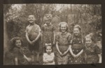 Jewish children who had been in hiding pose outside with Dutch children on liberation day.