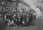 Group portrait of Jewish children outside the Château des Morelles children's home.