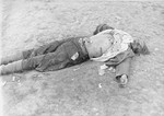 The corpse of an SS guard who was killed by Soviet prisoners after the arrival of the American army at Ohrdruf.