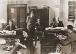 The staff of the Foto-Brenner company at work in their office in Rome.