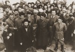 Jewish DPs in the Neu Freimann displaced persons camp gather outside to listen to a news broadcast over the public address system.