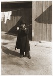 Publicity photo of the child violinist Hellmut Stern playing in the courtyard of his home in Harbin, China.
