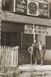 Izik Sutin and Mark Breslin stand outside the headquarters of the Hashomer Hatzair Zionist youth movement in the Foehrenwald displaced persons camp.