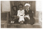 Danuta Schapira (left) poses with the daughters of the town baker while in hiding in Zaklikow.