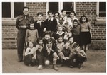 Group portrait of students and teachers at the Lueneberg children's home and school.