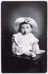 A studio portrait of Anita Kuenstler taken while she was in hiding at the age of two.