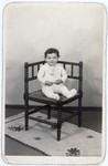 Portrait of Tswi Herschel seated in a chair, taken while he was living in hiding.