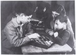 Simon and Michel Jeruchim play checkers in the home Cailly-sur-Eure near Evreux, Normandy, France.