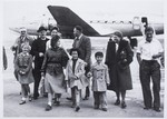 Father Louis Celis and Maria Tabruyn arrive at Lod Airport accompanied by the children they rescued: Regina, Wolfgang, Siegmund, and Sonja Rotenberg.
