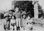 Belgian children pose with American soldiers in Brussels.
