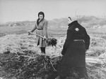 Two women work on a large agricultural plot in the Kovno ghetto.