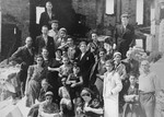 Group portrait of  Jews who survived in a malina (bunker), in the Kovno ghetto.