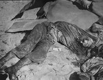 The charred corpse of Rabbi Shmukliarski in his bunker after the razing of the Kovno ghetto.