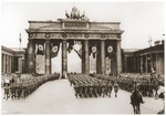 The first German troops to return from the conquests of Poland and France march through the Brandenburg Gate in Berlin.