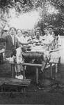 Jewish youth drink a toast at a garden party in Hlohovec, Czechoslovakia.