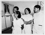 Four Jewish medical students study a lung x-ray.

From left to right are Paul Ornstein, his wife Anna Brunn Ornstein, Luisa Schwarzwald and Stephen Hornstein.