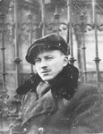 Benjamin Miedzyrzecki, a member of the Jewish underground living in hiding on false papers, poses in Ogrod Saski (Saski Gardens) on the Aryan side of Warsaw.