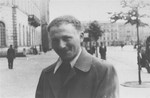 Benjamin Miedzyrzecki, a member of the Jewish underground living in hiding on false papers, poses in Plac Teatralny (Theater Square) on the Aryan side of Warsaw.