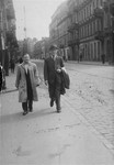 Stefan Grajek (right) leads Tuwia Borzykowski through the streets of Aryan Warsaw to a new hiding place.