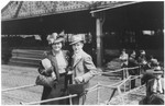 A Jewish refugee couple poses on the gangway of the MS St.