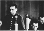 Defendant Kurt Eccarius speaks from the dock at the Sachsenhausen concentration camp war crimes trial in Berlin.