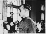 [A witness] testifies at the Sachsenhausen concentration camp war crimes trial in Berlin.