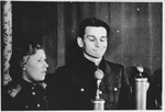 A defendant (probably Michael Koerner) speaks from the dock at the Sachsenhausen concentration camp war crimes trial in Berlin.