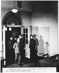 Defendants Anton Kaindl (front) and August Hoehn (left) are led into the courtroom at the Sachsenhausen concentration camp war crimes trial in Berlin.