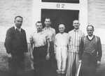 A group of Czech political prisoners stands in front of the infirmary in Theresienstadt.