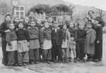 Class portrait of Jewish children and teachers at the Schauenstein displaced persons camp.