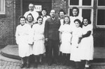 Members of the medical staff at the Schauenstein displaced persons camp for children pose at the entrance to the clinic.