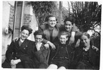 Jewish teenagers pose outside on the steps of the Chabannes children's home.