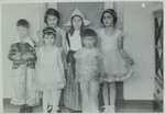 Group portrait of Jewish children wearing costumes for the Purim holiday.