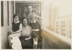 Members of the Ledermann family, Jewish refugees from Berlin, pose outside on the terrace of their apartment in Amsterdam.